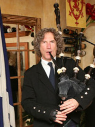 Bagpipe instructor Michel d'Avenas playing for a group
