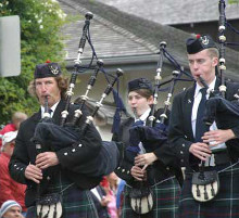 Michel d'Avenas and the Monterey Bay Pipe Band playing bagpipes at the Scottish Highland Games