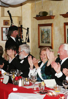 Photo of Michel playing bagpipes for some kind of scottish event in the bay area